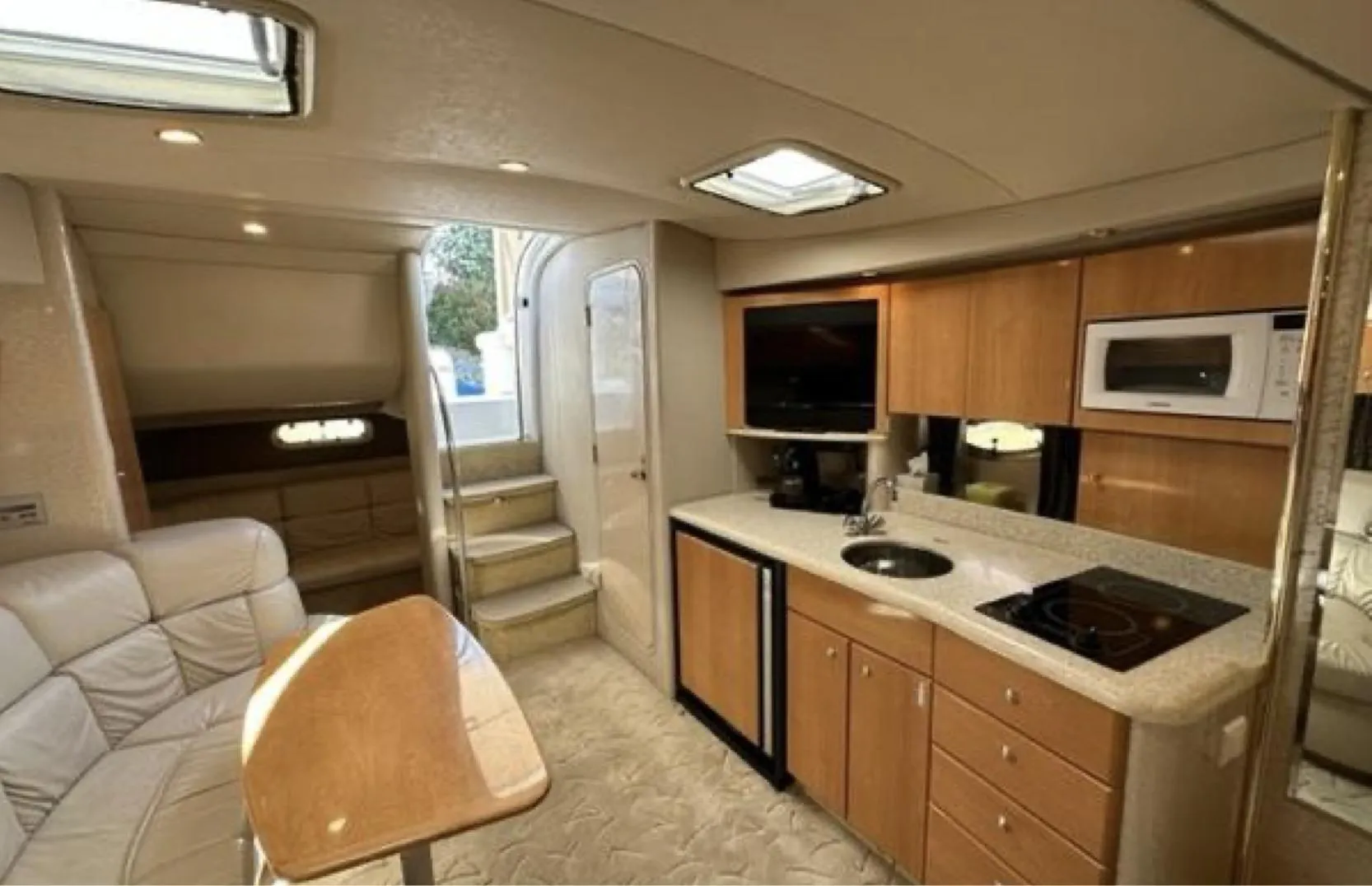 Interior of a 2003 Formula 37 PC yacht with modern kitchen and seating area.