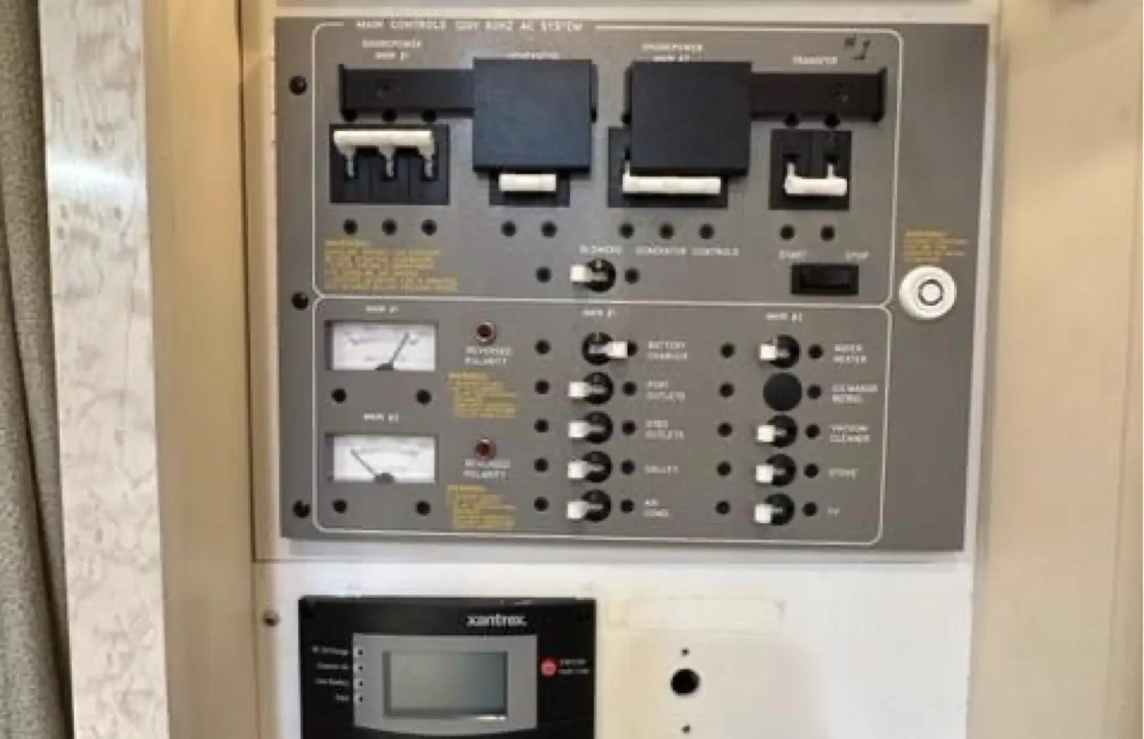Electrical control panel of a 2003 Formula 37 PC boat, featuring switches and gauges.