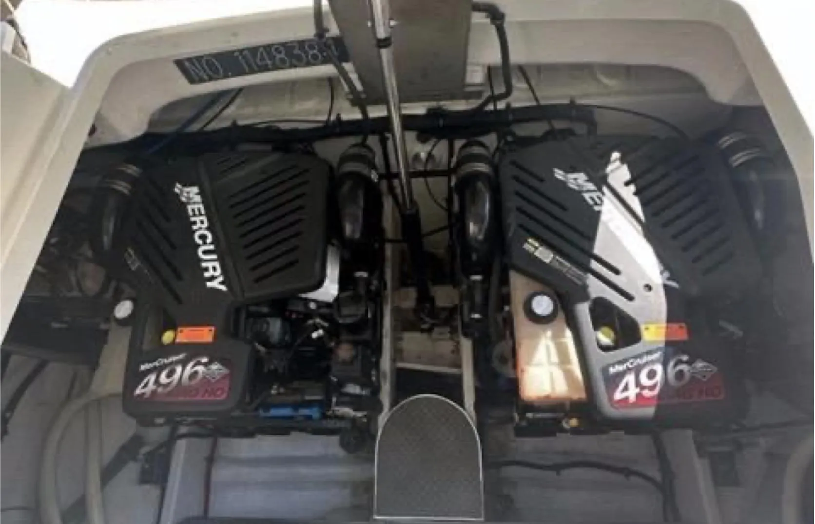 Twin Mercury engines in a 2003 Formula 37 PC boat engine compartment.