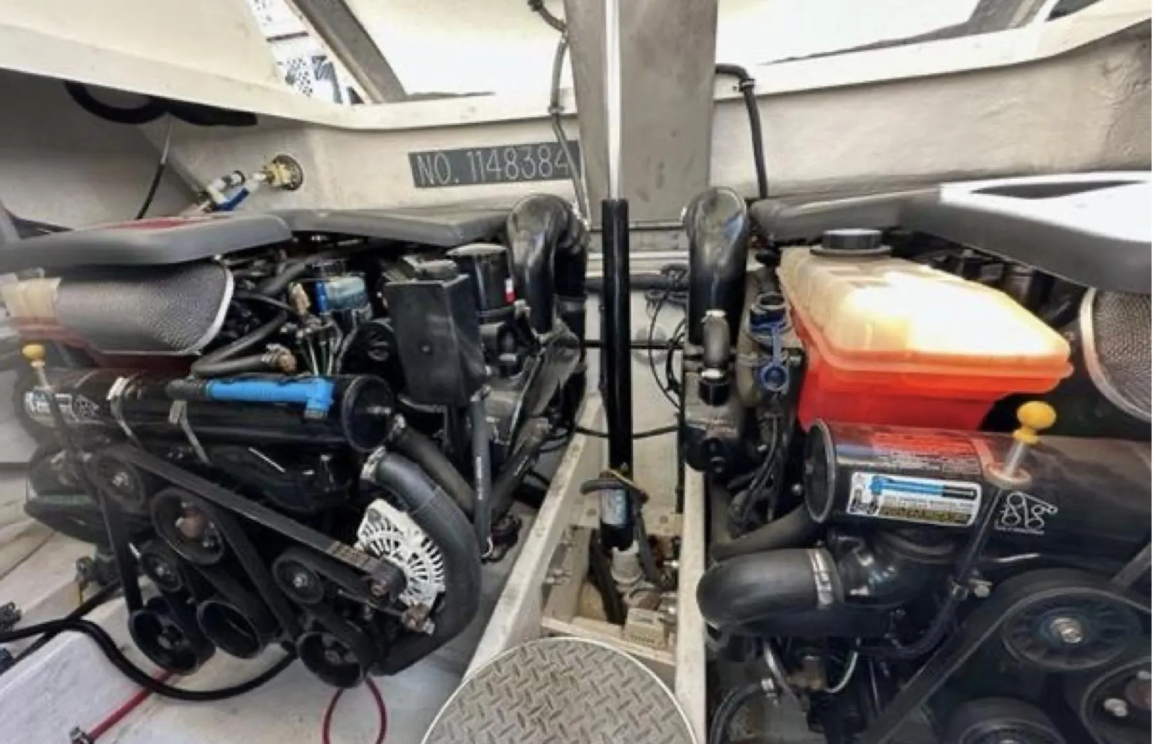 Engine compartment of a 2003 Formula 37 PC boat, showcasing dual engines and mechanical components.