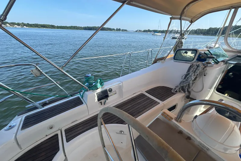 Table 4 Two Yacht Photos Pics 2004 Beneteau Oceanis 423 sailboat cockpit with scenic water view.