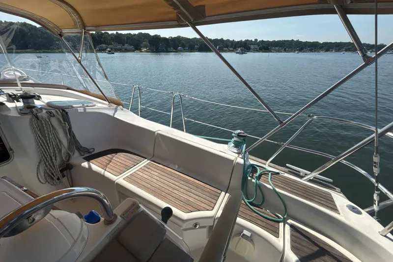 Table 4 Two Yacht Photos Pics Cockpit view of 2004 Beneteau Oceanis 423 sailboat on calm water.