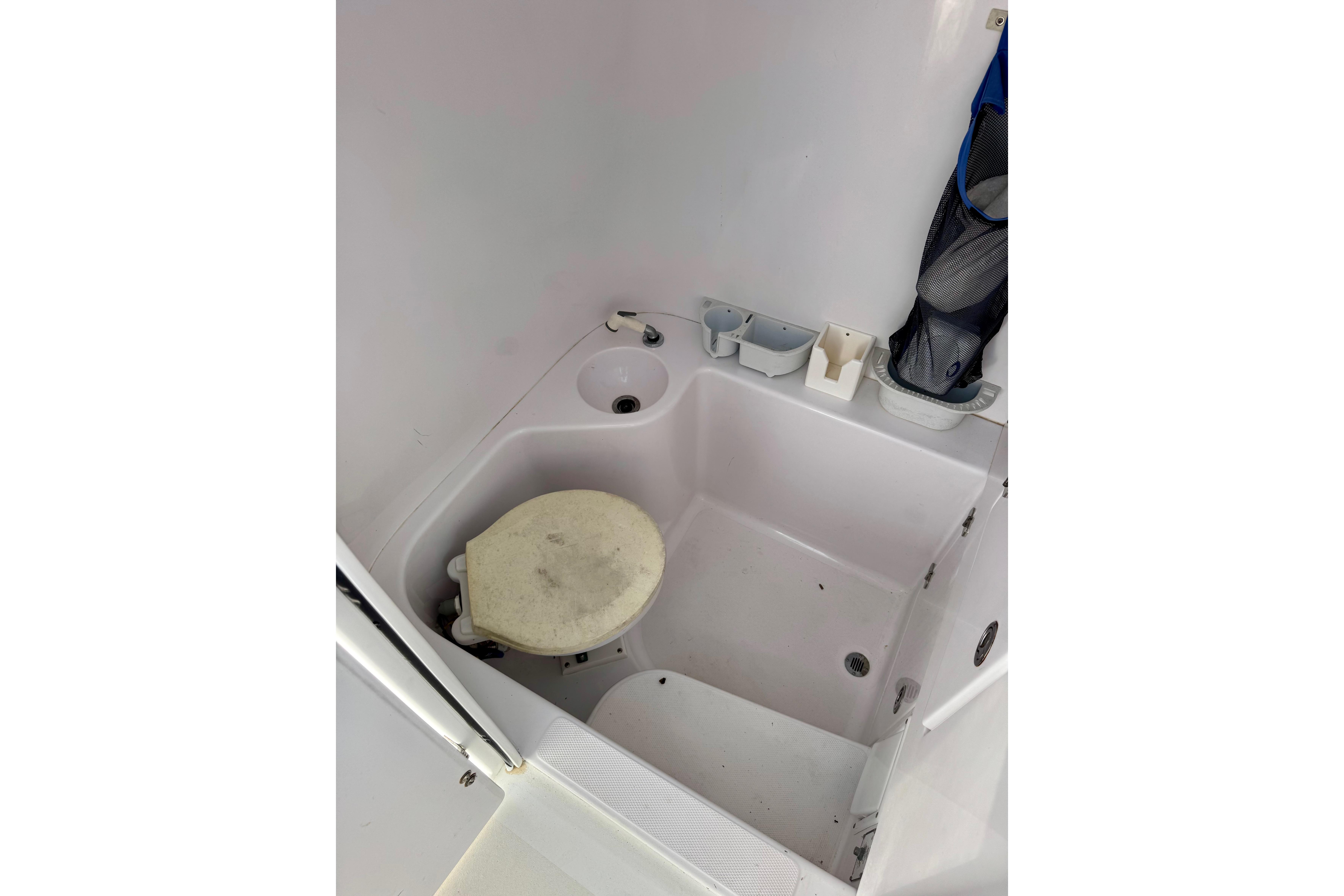 2010 Venture 34 Tournament boat bathroom interior with sink and toilet.