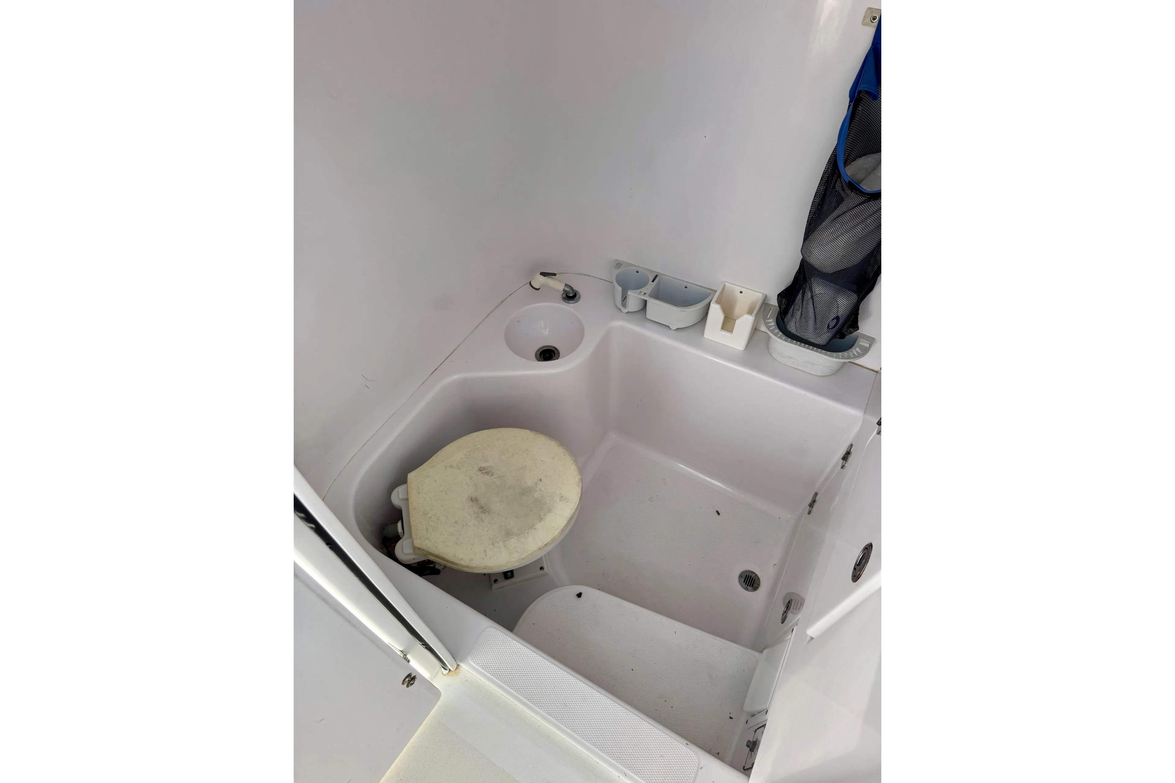 2010 Venture 34 Tournament boat bathroom interior with sink and toilet.