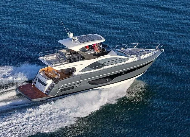 Luxury Schaefer 660 yacht cruising on open water, 2025 model.