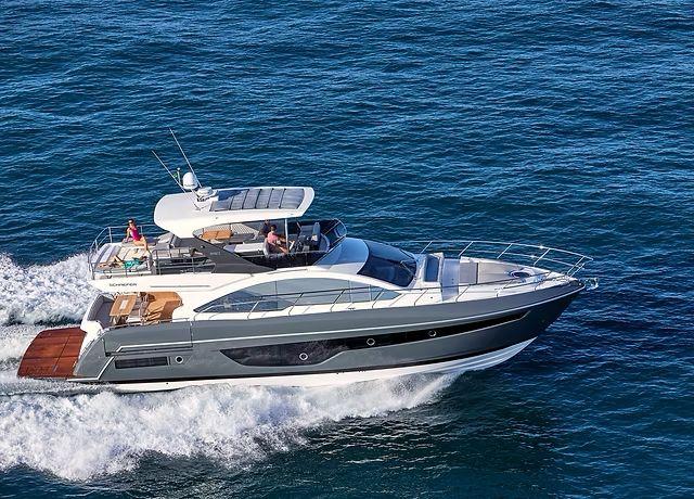 Luxury Schaefer 660 yacht cruising on open sea, 2025 model.
