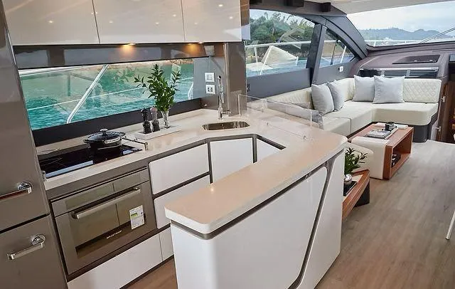  Yacht Photos Pics Luxurious Schaefer 660 yacht interior with modern kitchen and cozy seating area, 2025 model.