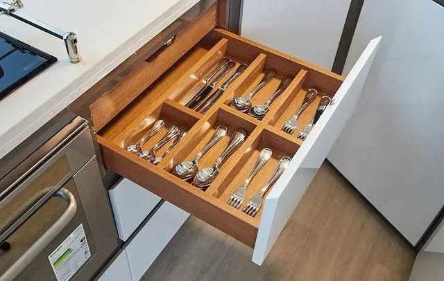  Yacht Photos Pics Modern kitchen drawer with organized cutlery in a Schaefer 660, 2025 model.