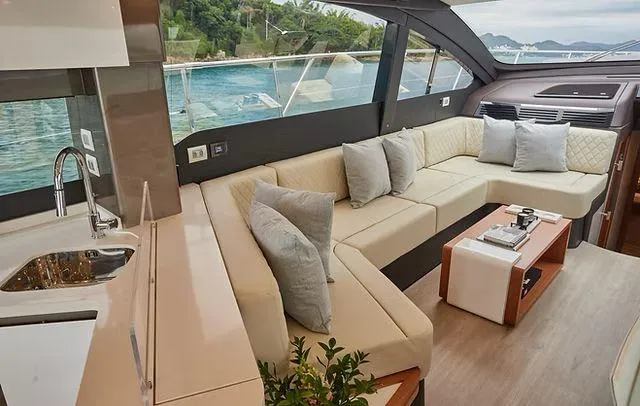  Yacht Photos Pics Luxurious interior of 2025 Schaefer 660 yacht with elegant seating and scenic ocean view.