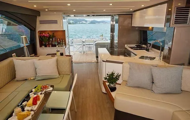  Yacht Photos Pics Luxurious interior of 2025 Schaefer 660 yacht with modern kitchen and ocean view.