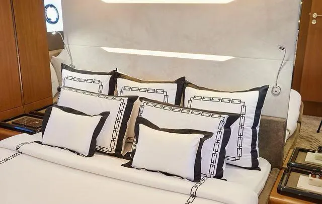  Yacht Photos Pics Luxurious Schaefer 660 yacht bedroom with elegant bedding, 2025 model.