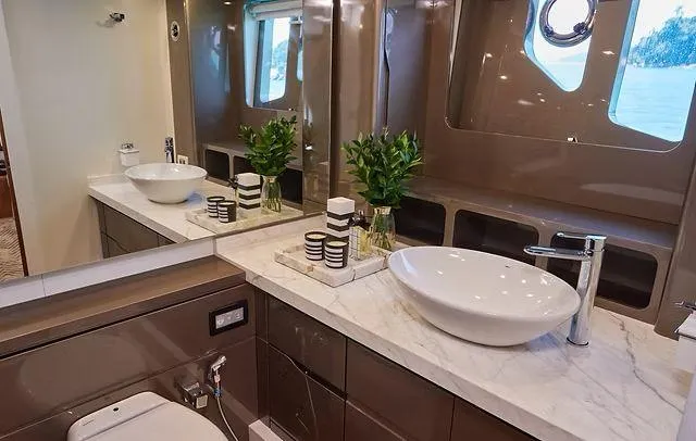  Yacht Photos Pics Luxurious bathroom in 2025 Schaefer 660 yacht with modern fixtures and elegant design.