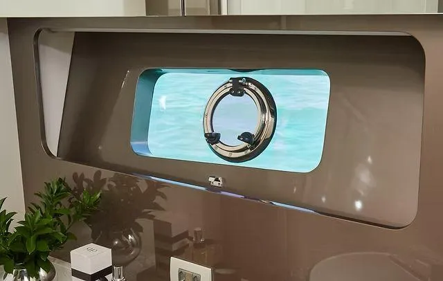  Yacht Photos Pics Porthole view from Schaefer 660 yacht, 2025 model, with ocean scenery.