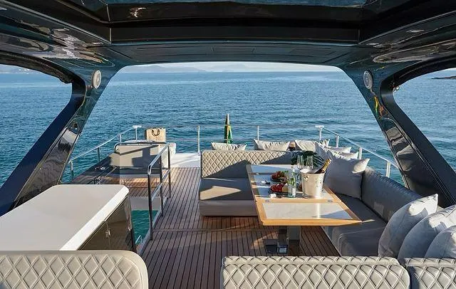  Yacht Photos Pics Luxurious Schaefer 660 yacht deck with elegant seating, ocean view, and dining setup, 2025 model.