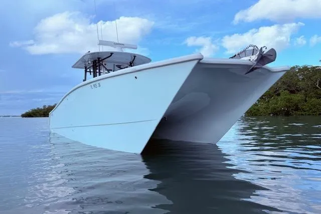  Yacht Photos Pics 2019 Freeman 34 boat on calm water under a blue sky.