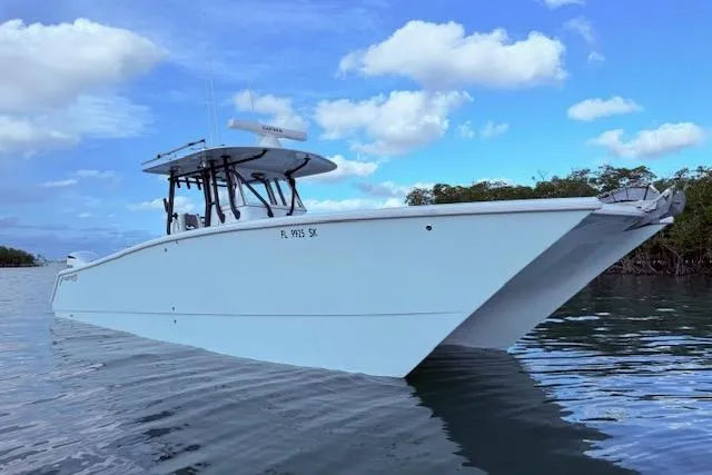  Yacht Photos Pics 2019 Freeman 34 boat on calm water under blue sky.
