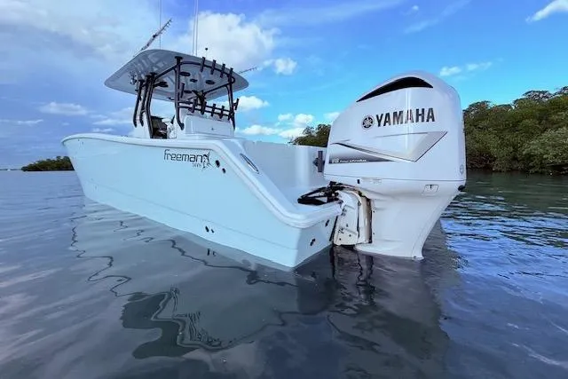  Yacht Photos Pics 2019 Freeman 34 boat with Yamaha engine on calm water.