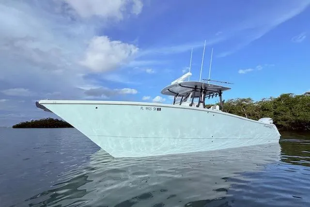  Yacht Photos Pics 2019 Freeman 34 boat on calm water under a blue sky.