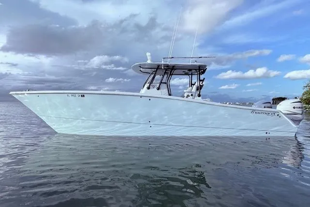  Yacht Photos Pics 2019 Freeman 34 boat on calm water under cloudy sky.