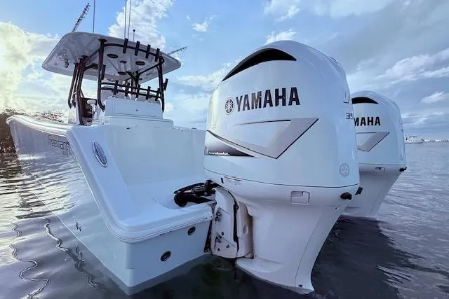  Yacht Photos Pics 2019 Freeman 34 boat with twin Yamaha outboard engines on calm water.