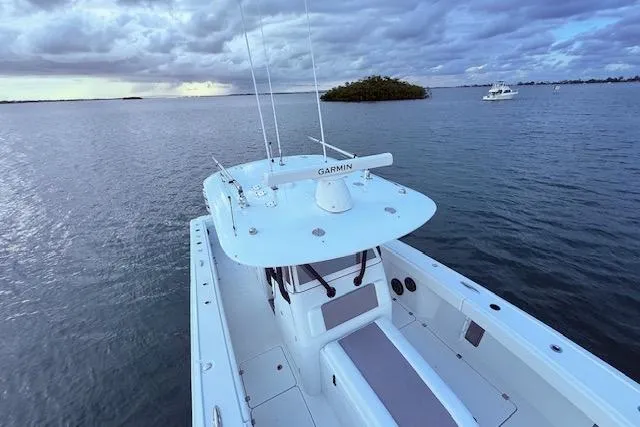  Yacht Photos Pics 2019 Freeman 34 boat on calm water under cloudy sky.