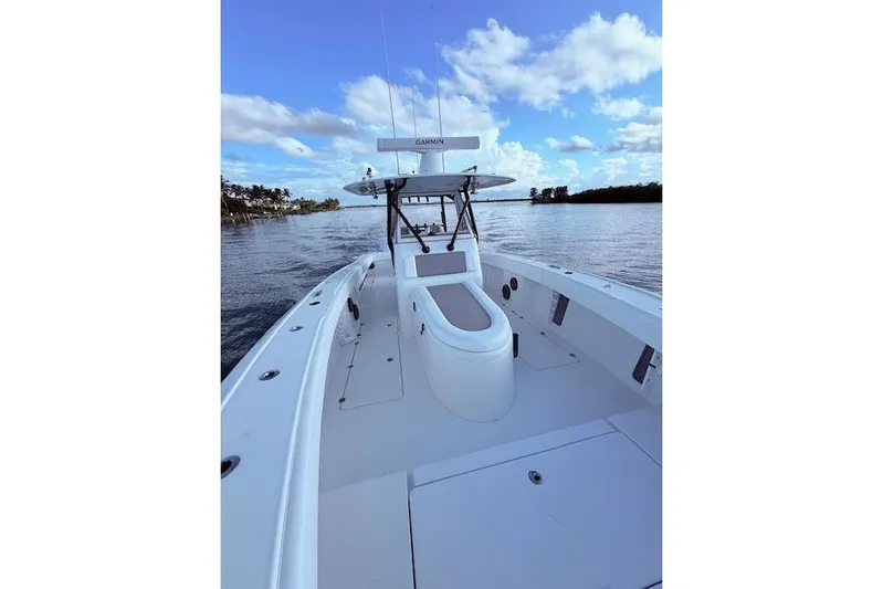 Yacht Photos Pics 2019 Freeman 34 boat on calm water under a blue sky with clouds.
