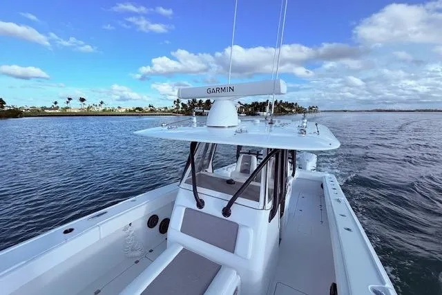  Yacht Photos Pics 2019 Freeman 34 boat on calm water under a blue sky.