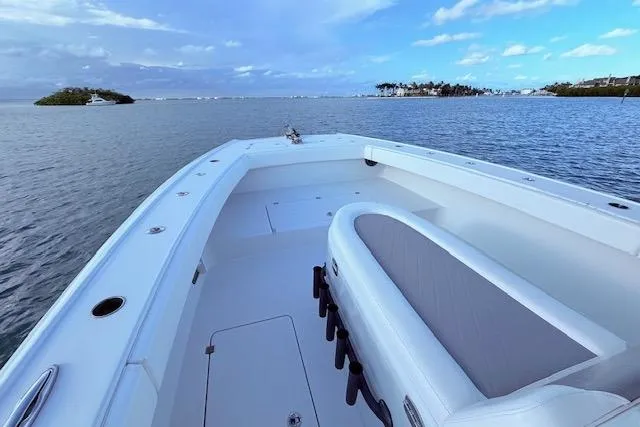  Yacht Photos Pics 2019 Freeman 34 boat on calm waters with scenic island view.