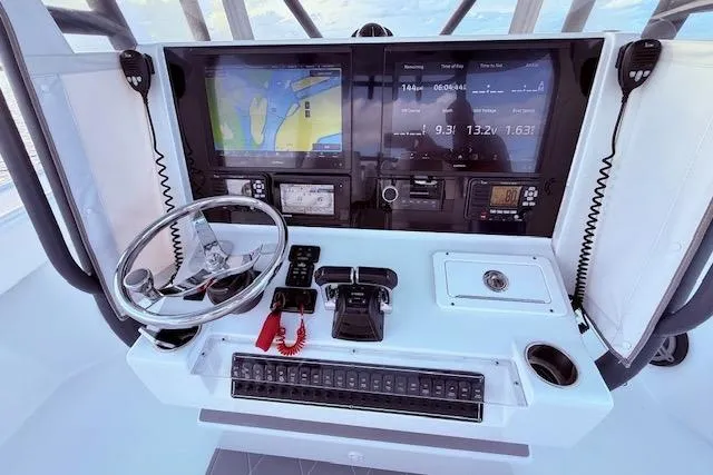  Yacht Photos Pics Cockpit of 2019 Freeman 34 boat with navigation screens and controls.