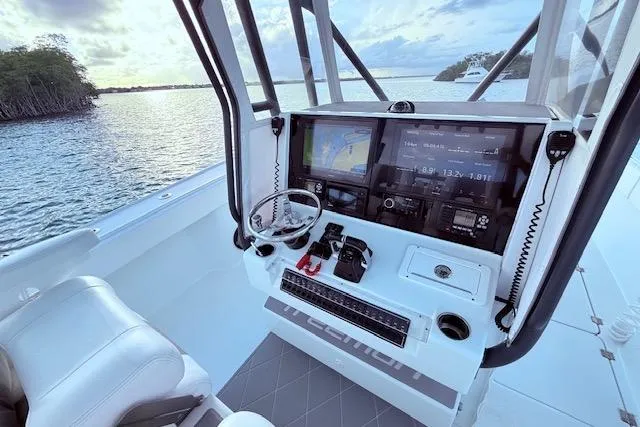  Yacht Photos Pics 2019 Freeman 34 boat cockpit with advanced navigation system and scenic water view.