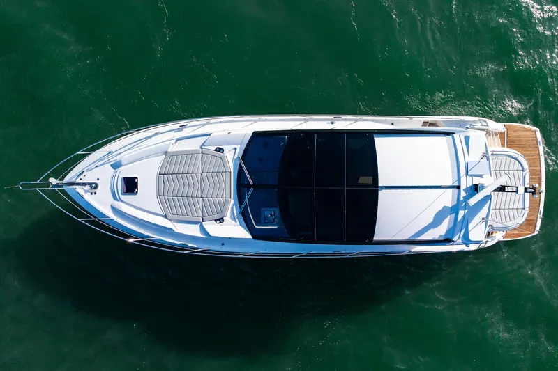 Andielaine IV Yacht Photos Pics Overhead view of 2021 Sunseeker 60 Evo yacht on green water.