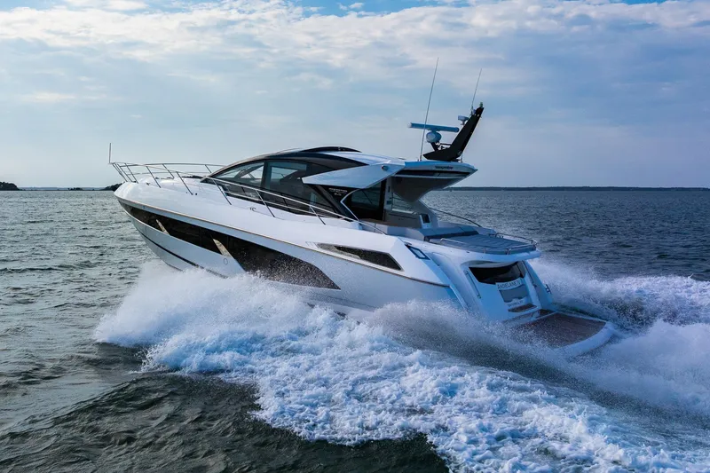 Andielaine IV Yacht Photos Pics Luxurious 2021 Sunseeker 60 Evo yacht cruising on open water.