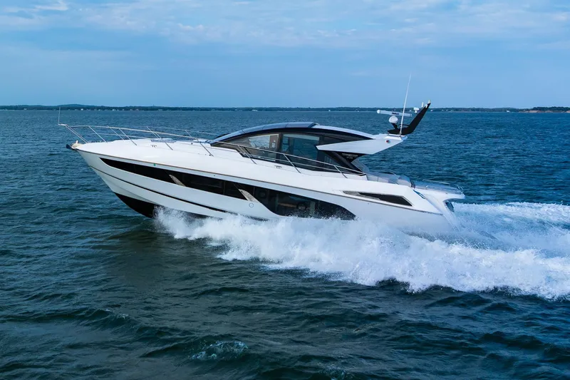 Andielaine IV Yacht Photos Pics 2021 Sunseeker 60 Evo yacht cruising on open water, showcasing sleek design and luxury.