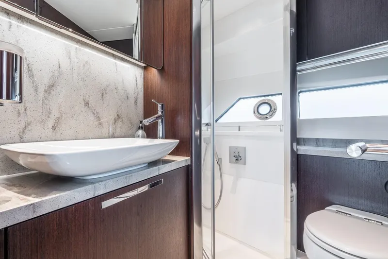 Andielaine IV Yacht Photos Pics Luxurious bathroom interior of 2021 Sunseeker 60 Evo yacht with modern fixtures.