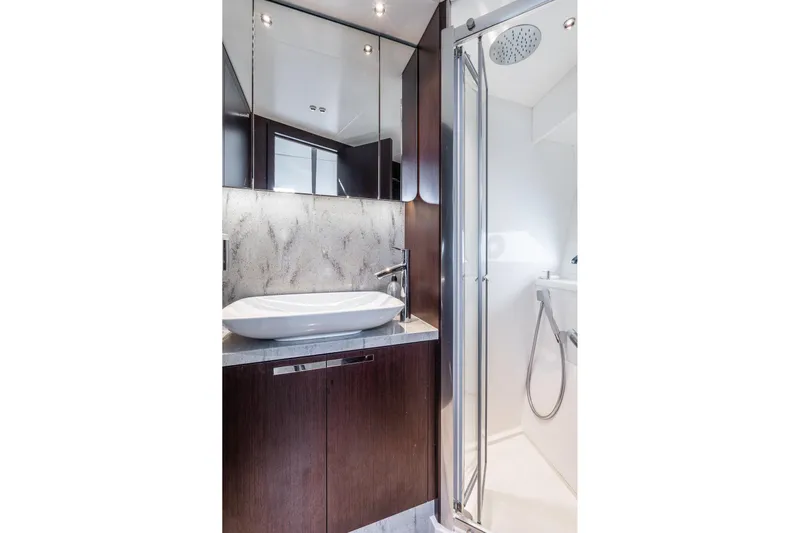 Andielaine IV Yacht Photos Pics Luxurious bathroom in 2021 Sunseeker 60 Evo yacht with modern fixtures and elegant design.