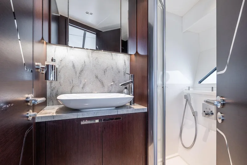 Andielaine IV Yacht Photos Pics Luxurious bathroom in 2021 Sunseeker 60 Evo yacht with modern fixtures and elegant design.