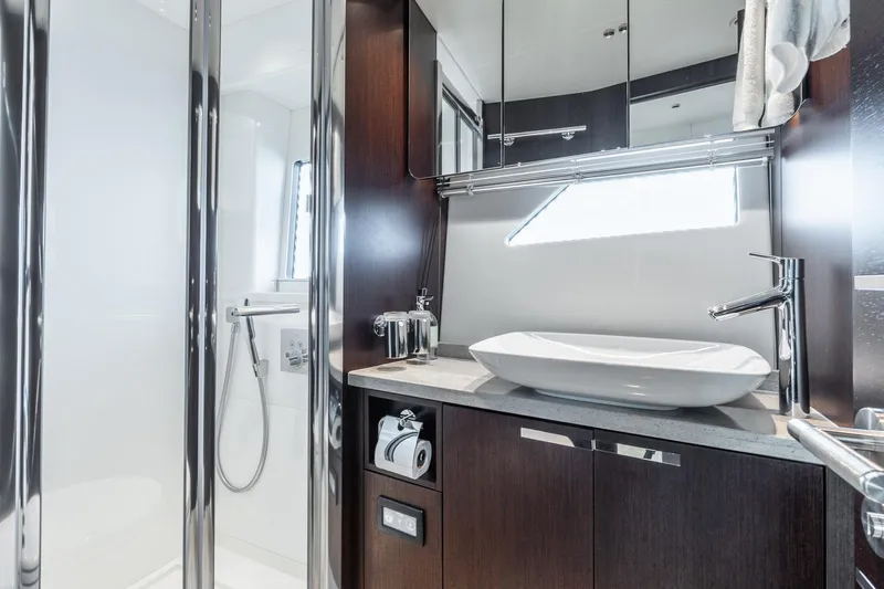 Andielaine IV Yacht Photos Pics Luxurious bathroom in 2021 Sunseeker 60 Evo yacht with modern fixtures and elegant design.