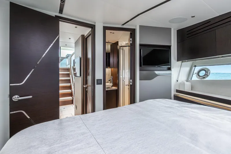 Andielaine IV Yacht Photos Pics Luxurious interior of 2021 Sunseeker 60 Evo yacht with modern bedroom and ocean view.