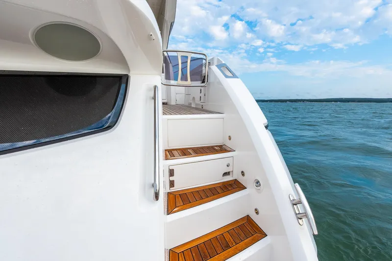 Andielaine IV Yacht Photos Pics Staircase on 2021 Sunseeker 60 Evo yacht with ocean view.