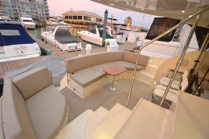 Play Craft Yacht Photos Pics Luxurious 2018 Carver C52 Flybridge yacht interior at marina during sunset.