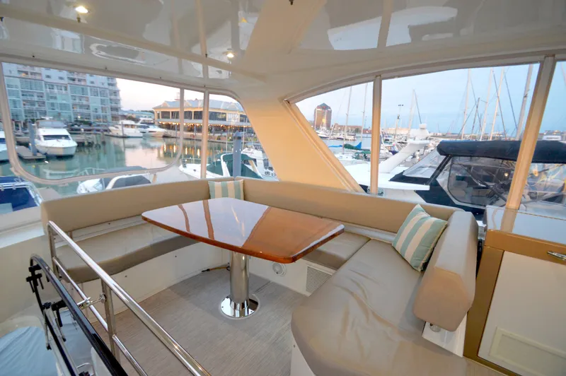 Play Craft Yacht Photos Pics Luxurious 2018 Carver C52 Flybridge yacht interior with marina view.