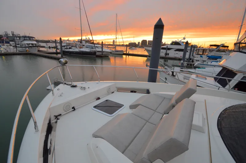 Play Craft Yacht Photos Pics 2018 Carver C52 Flybridge yacht at sunset in marina.