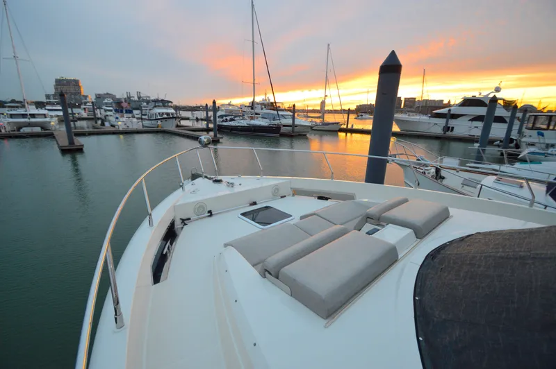 Play Craft Yacht Photos Pics 2018 Carver C52 Flybridge yacht at marina during sunset, showcasing luxurious deck seating.