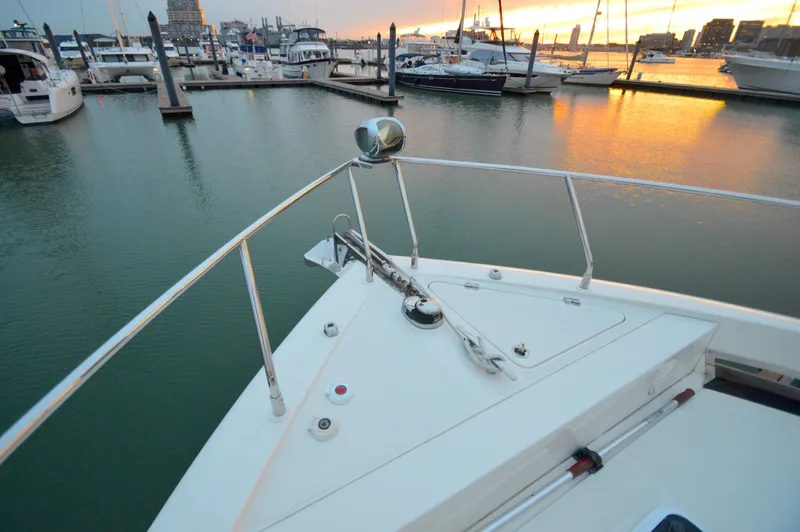 Play Craft Yacht Photos Pics 2018 Carver C52 Flybridge yacht at marina during sunset.