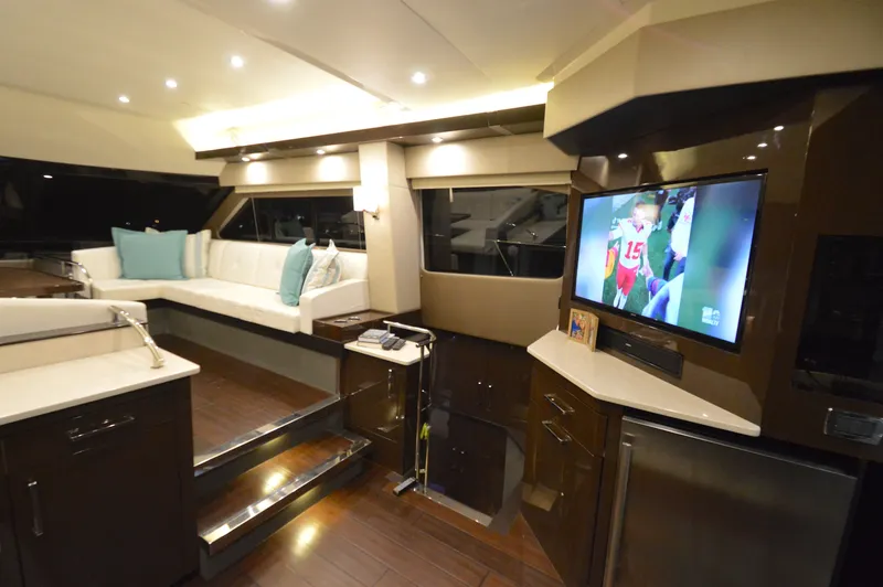 Play Craft Yacht Photos Pics Luxurious interior of 2018 Carver C52 Flybridge yacht with modern seating and entertainment system.