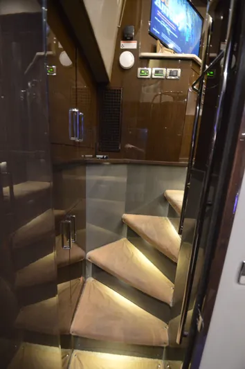 Play Craft Yacht Photos Pics Luxurious interior staircase of 2018 Carver C52 Flybridge yacht with ambient lighting.