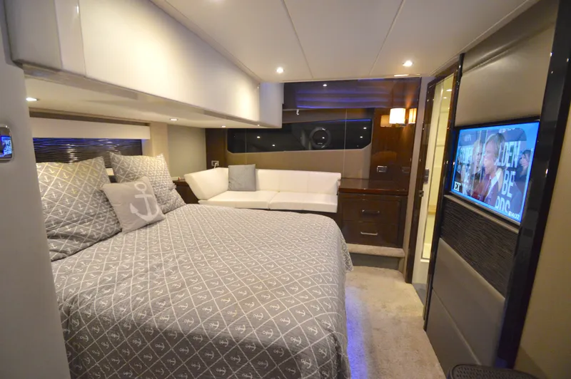 Play Craft Yacht Photos Pics Luxurious bedroom interior of 2018 Carver C52 Flybridge yacht with modern amenities.