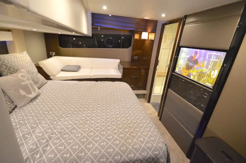 Play Craft Yacht Photos Pics Luxurious bedroom interior of 2018 Carver C52 Flybridge yacht with modern amenities.
