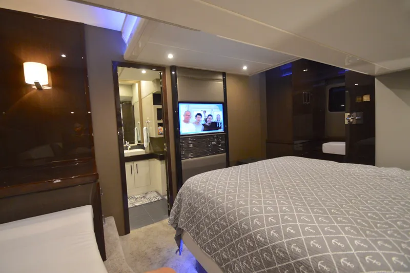 Play Craft Yacht Photos Pics Luxurious interior of 2018 Carver C52 Flybridge yacht with cozy bedroom and modern amenities.