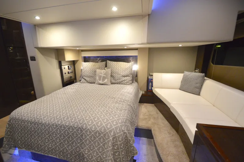 Play Craft Yacht Photos Pics Luxurious 2018 Carver C52 Flybridge bedroom with elegant bedding and ambient lighting.